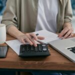 Person budgeting and calculating financ